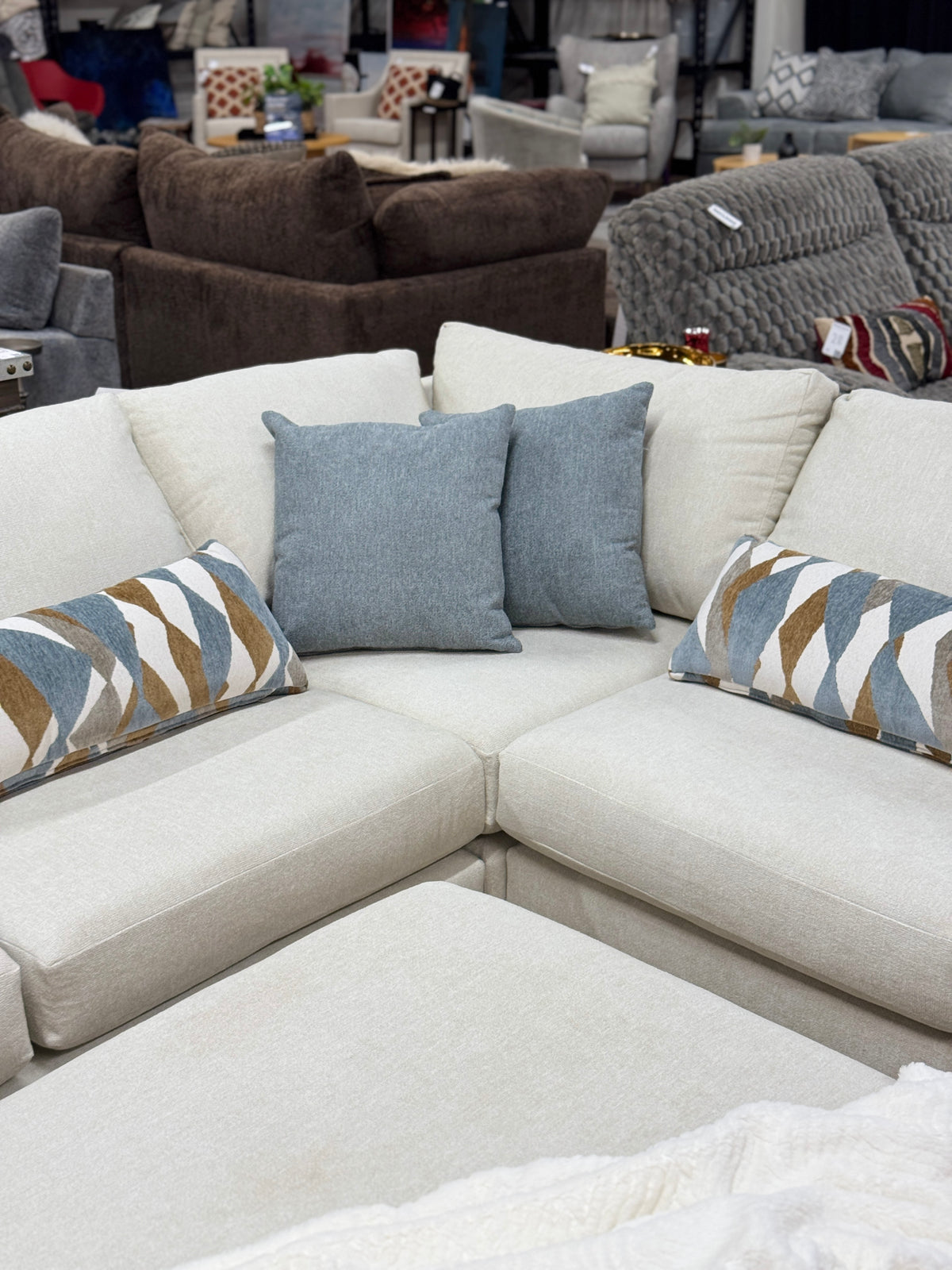 Cascade L-Shape Sectional in Cream with Rolling Ottoman